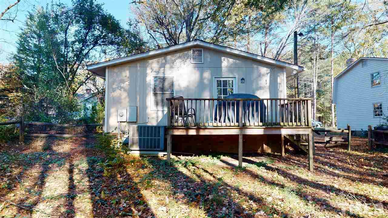 1503 Cole Mill Road Durham, NC 27705 - Photo 25 of 29 a view of a house with backyard and sitting area