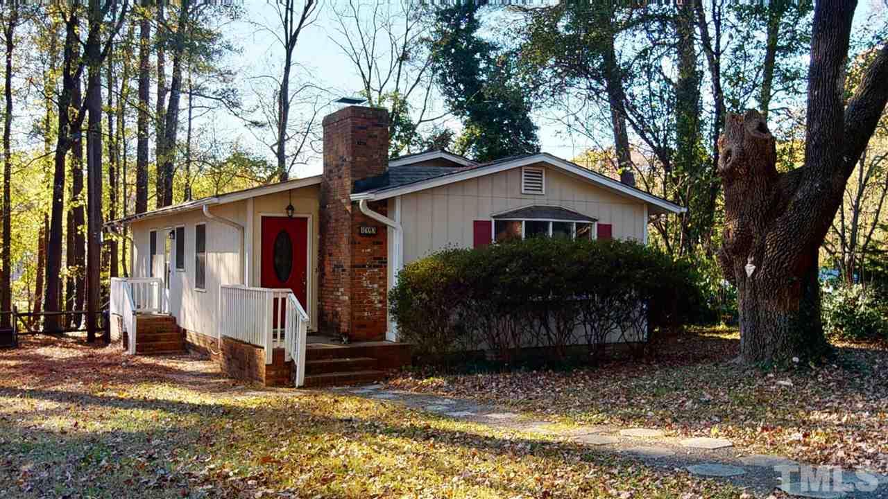 1503 Cole Mill Road Durham, NC 27705 - Photo 27 of 29 a front view of a house with garden
