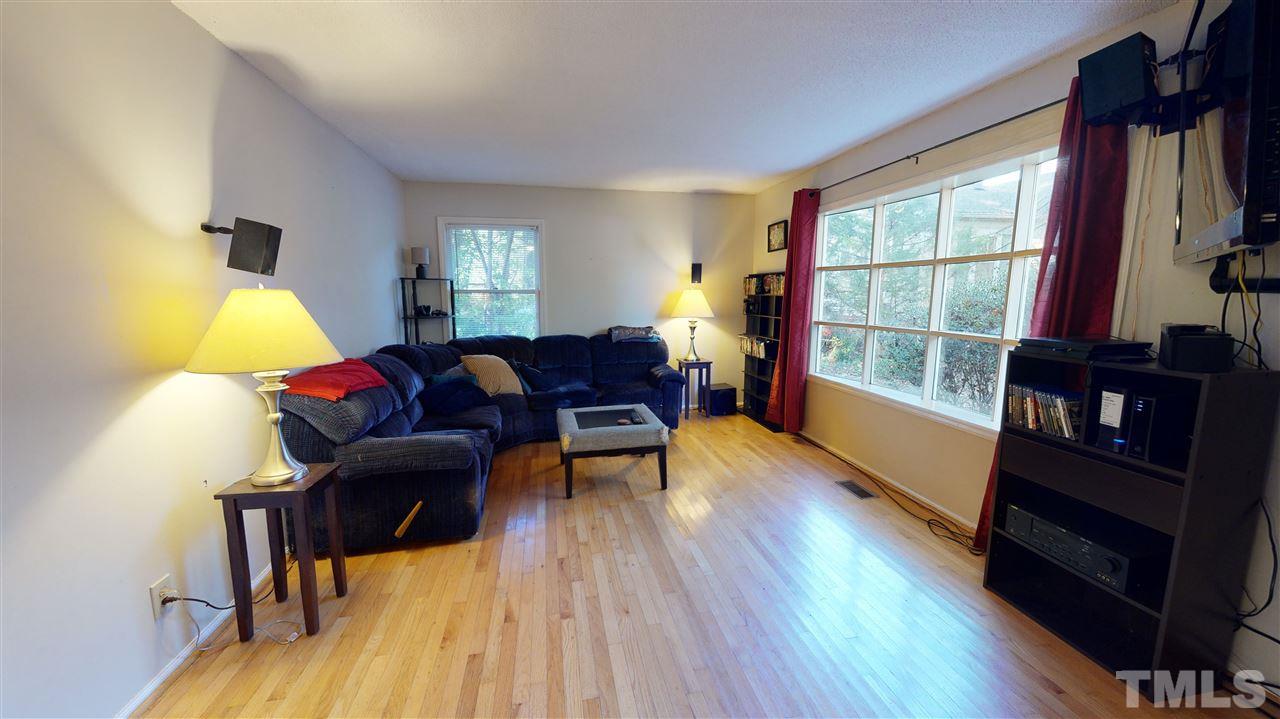 1503 Cole Mill Road Durham, NC 27705 - Photo 5 of 29 a living room with furniture and a wooden floor