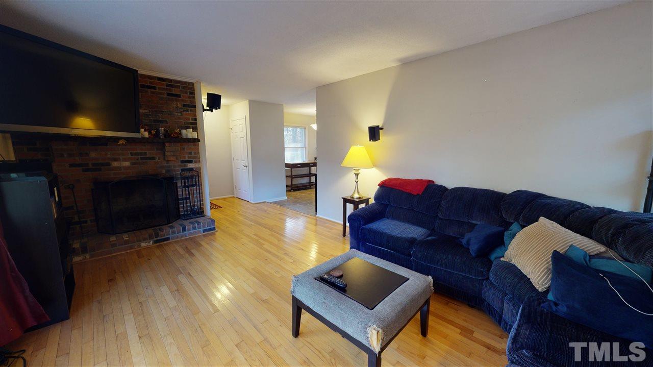 1503 Cole Mill Road Durham, NC 27705 - Photo 6 of 29 a living room with furniture and a flat screen tv