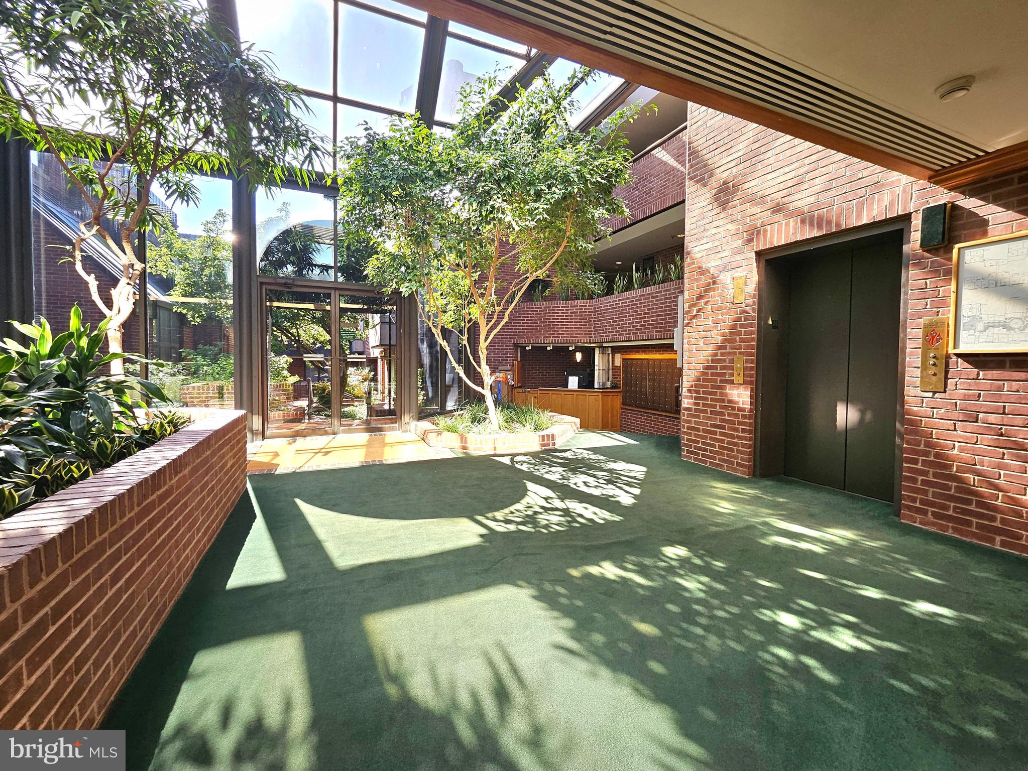 1080 Wisconsin Avenue Northwest, Unit 103/104 Washington, DC 20007 - Photo 34 of 37 a view of a back yard of the house