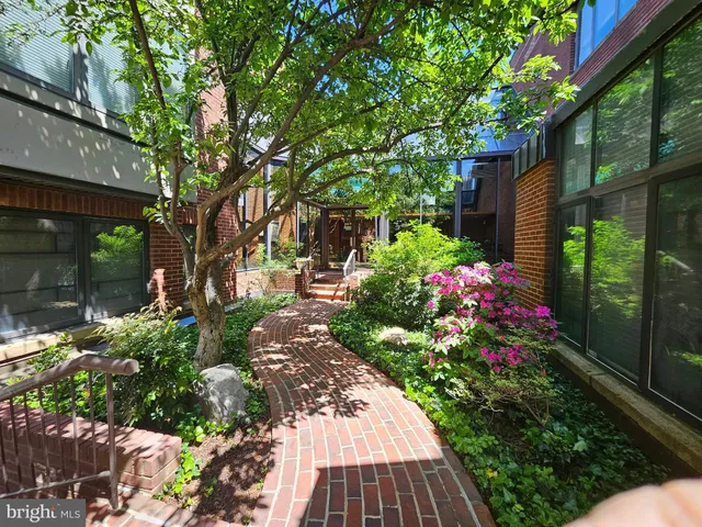 a view of flower garden with a patio