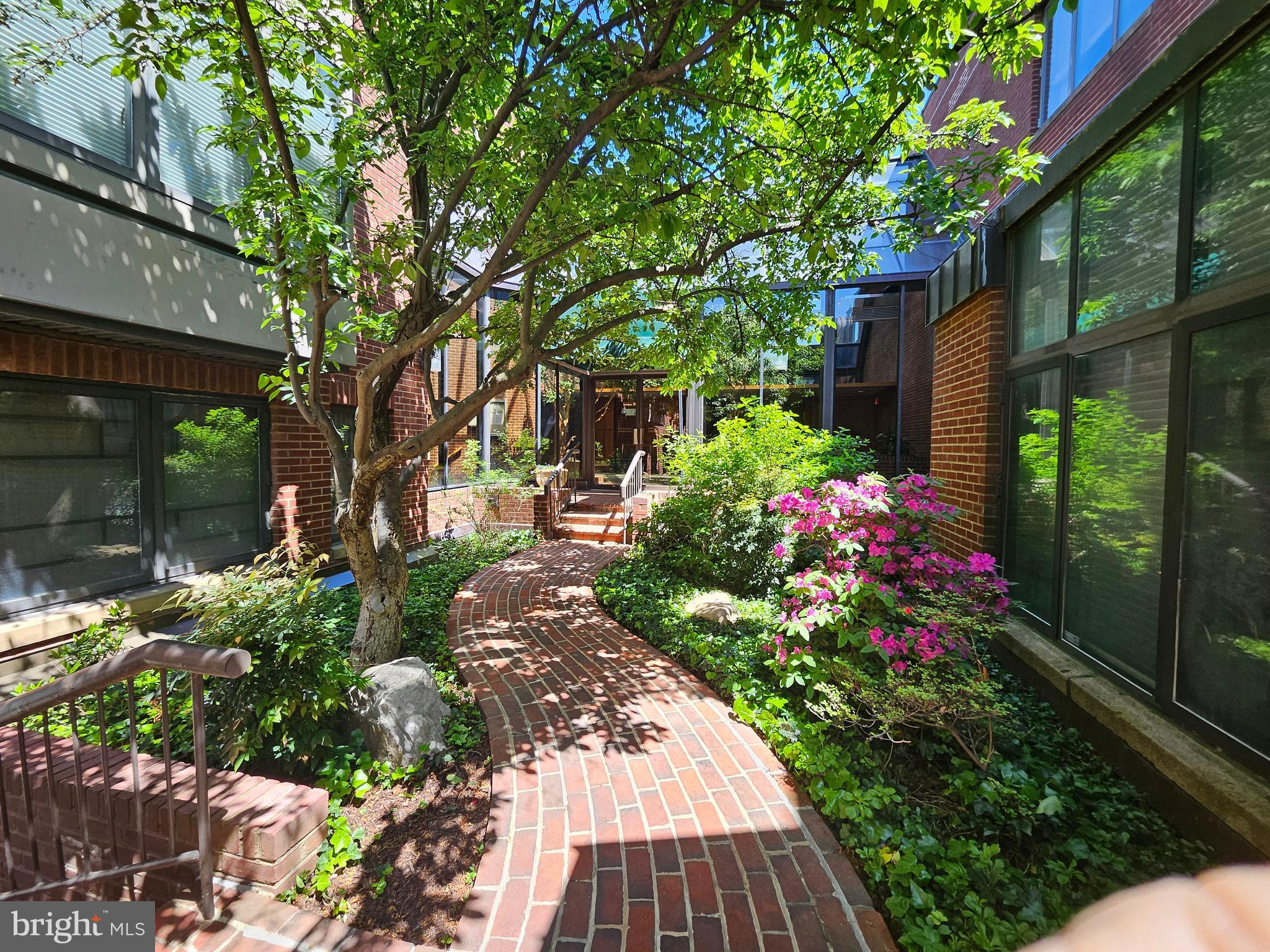 1080 Wisconsin Avenue Northwest, Unit 103/104 Washington, DC 20007 - Photo 35 of 37 a view of flower garden with a patio