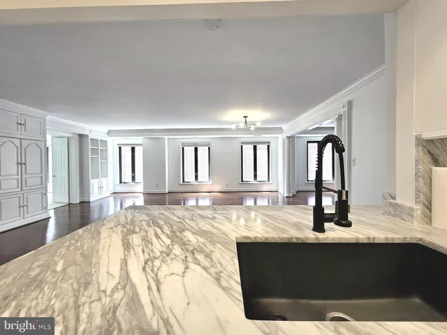 a view of living room with granite countertop furniture and fireplace