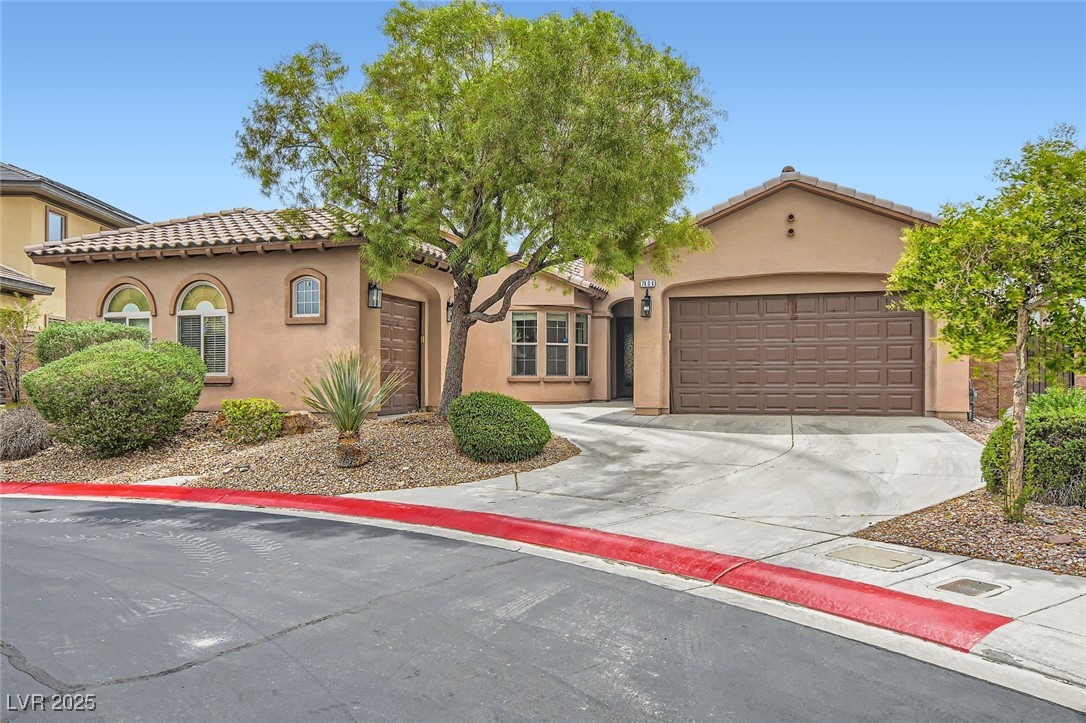 7404 Eggshell Drive North Las Vegas, NV 89084 - Photo 1 of 39 Mediterranean / spanish home featuring three car g