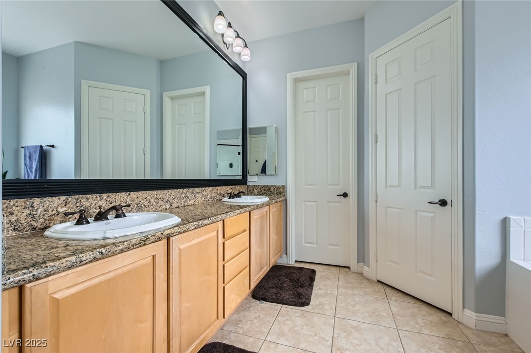 7404 Eggshell Drive North Las Vegas, NV 89084 - Photo 16 of 39 Bathroom featuring tile patterned floors, double v