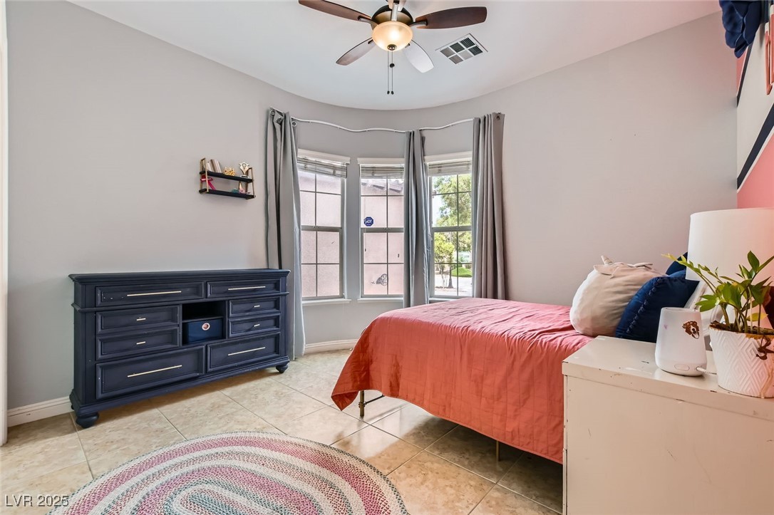 7404 Eggshell Drive North Las Vegas, NV 89084 - Photo 19 of 39 Bedroom #2 with ceiling fan & closet