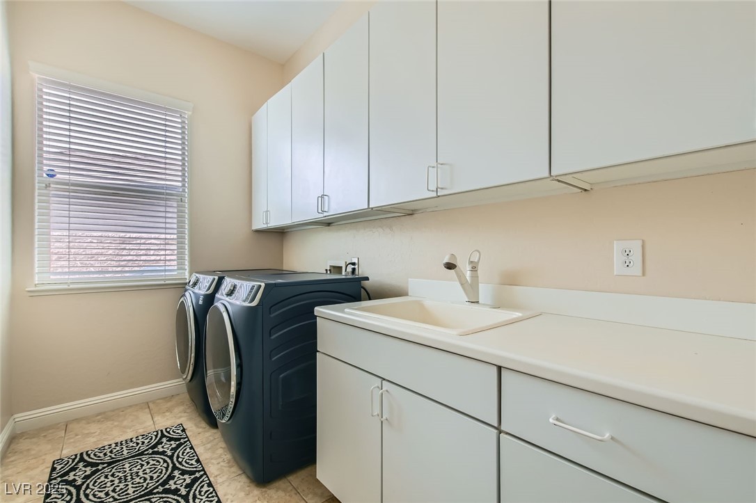 7404 Eggshell Drive North Las Vegas, NV 89084 - Photo 24 of 39 Laundry room with cabinet space, washing machine a