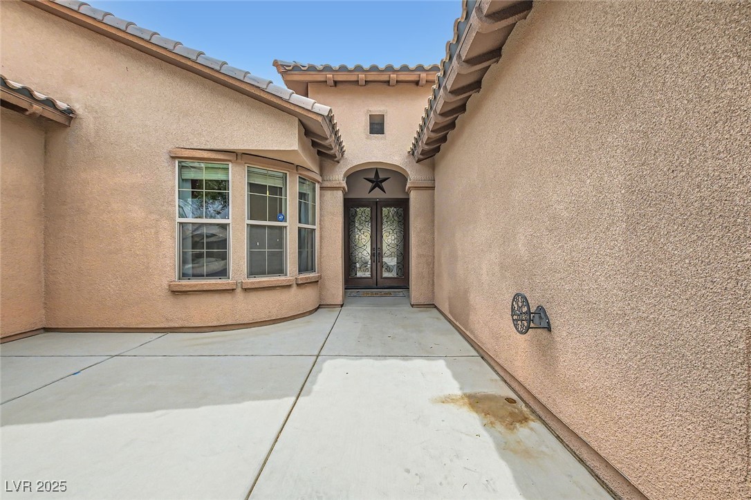 7404 Eggshell Drive North Las Vegas, NV 89084 - Photo 3 of 39 Entryway with custom French doors, courtyard area
