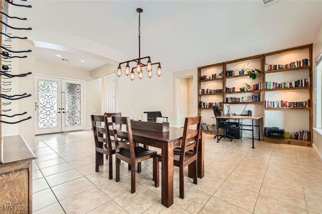 7404 Eggshell Drive North Las Vegas, NV 89084 - Photo 6 of 39 Dining space featuring upgraded lighting, french d