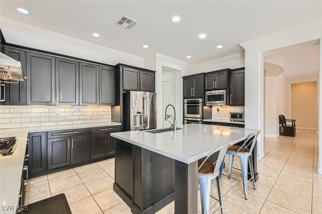 7404 Eggshell Drive North Las Vegas, NV 89084 - Photo 9 of 39 Kitchen with a xl sink, stainless steel appliances