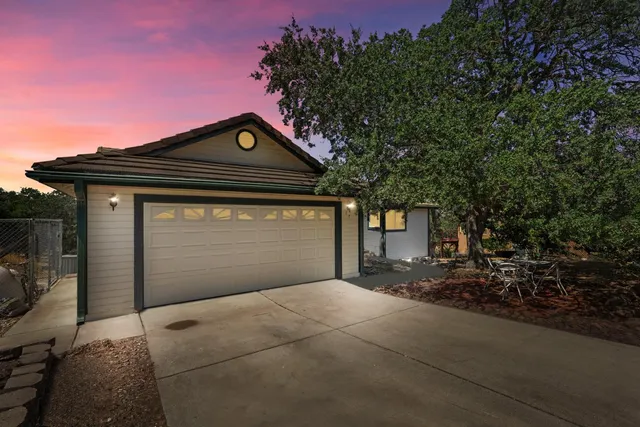 a front view of a house with a garage