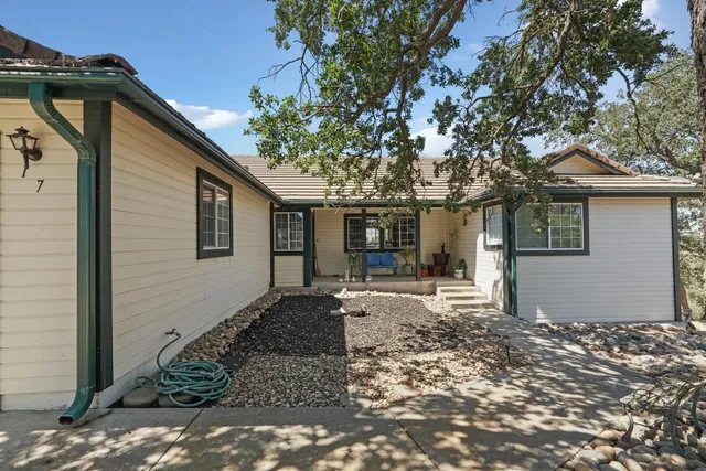 a bedroom with furniture and wooden floor