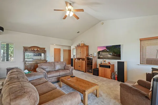 a view of a room with workspace and windows