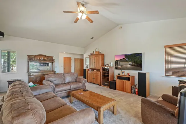 a living room with a couch and a dresser