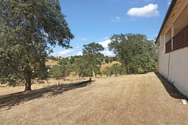 a view of a house with a tree
