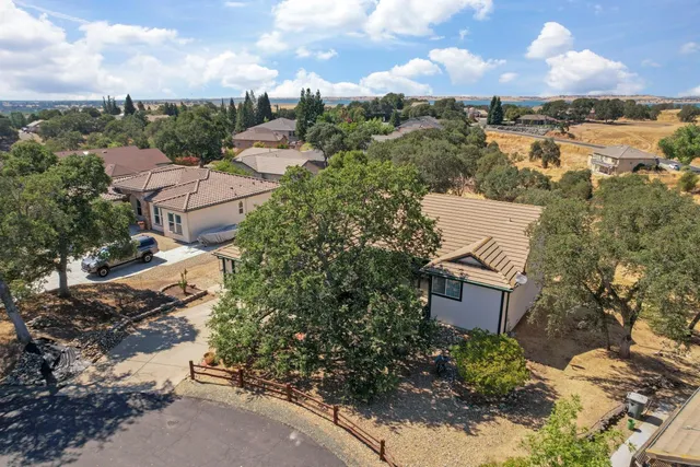 a view of a house with a tree