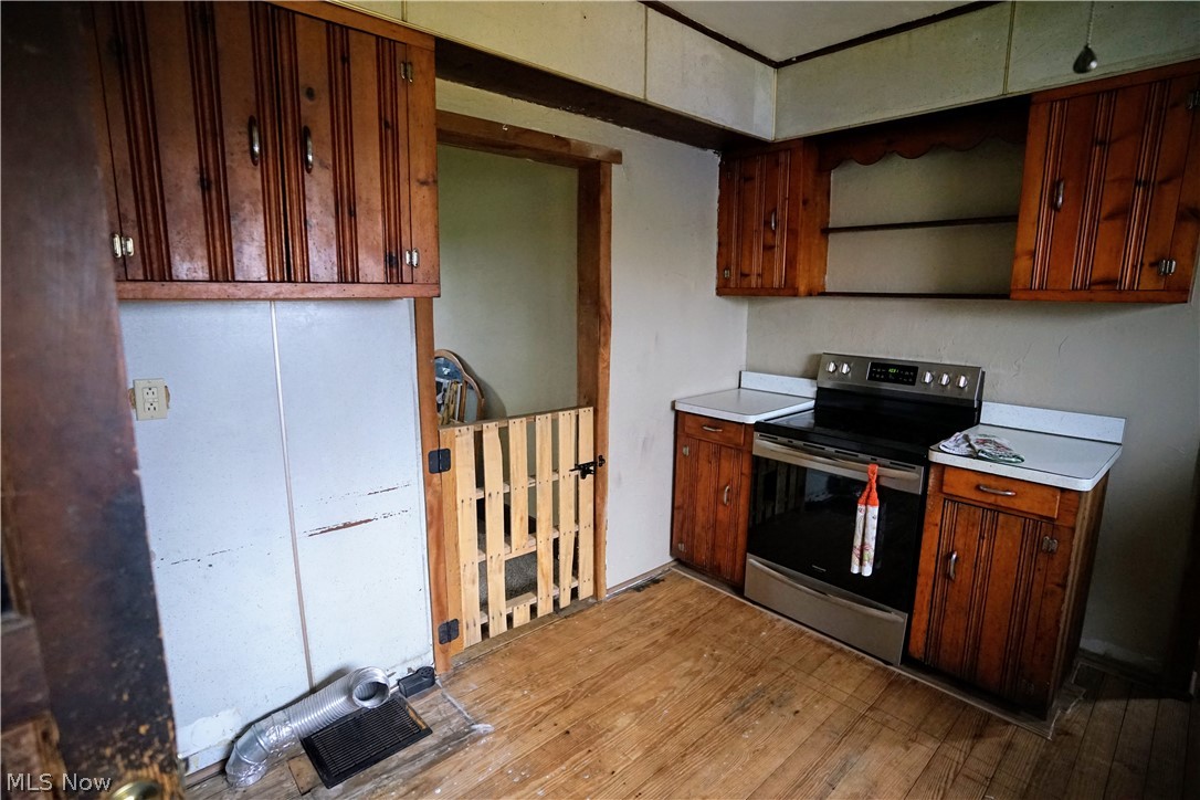 2212 Sentinel Road Dorset, OH 44032 - Photo 24 of 24 Kitchen featuring light hardwood / wood-style flooring and electric stove
