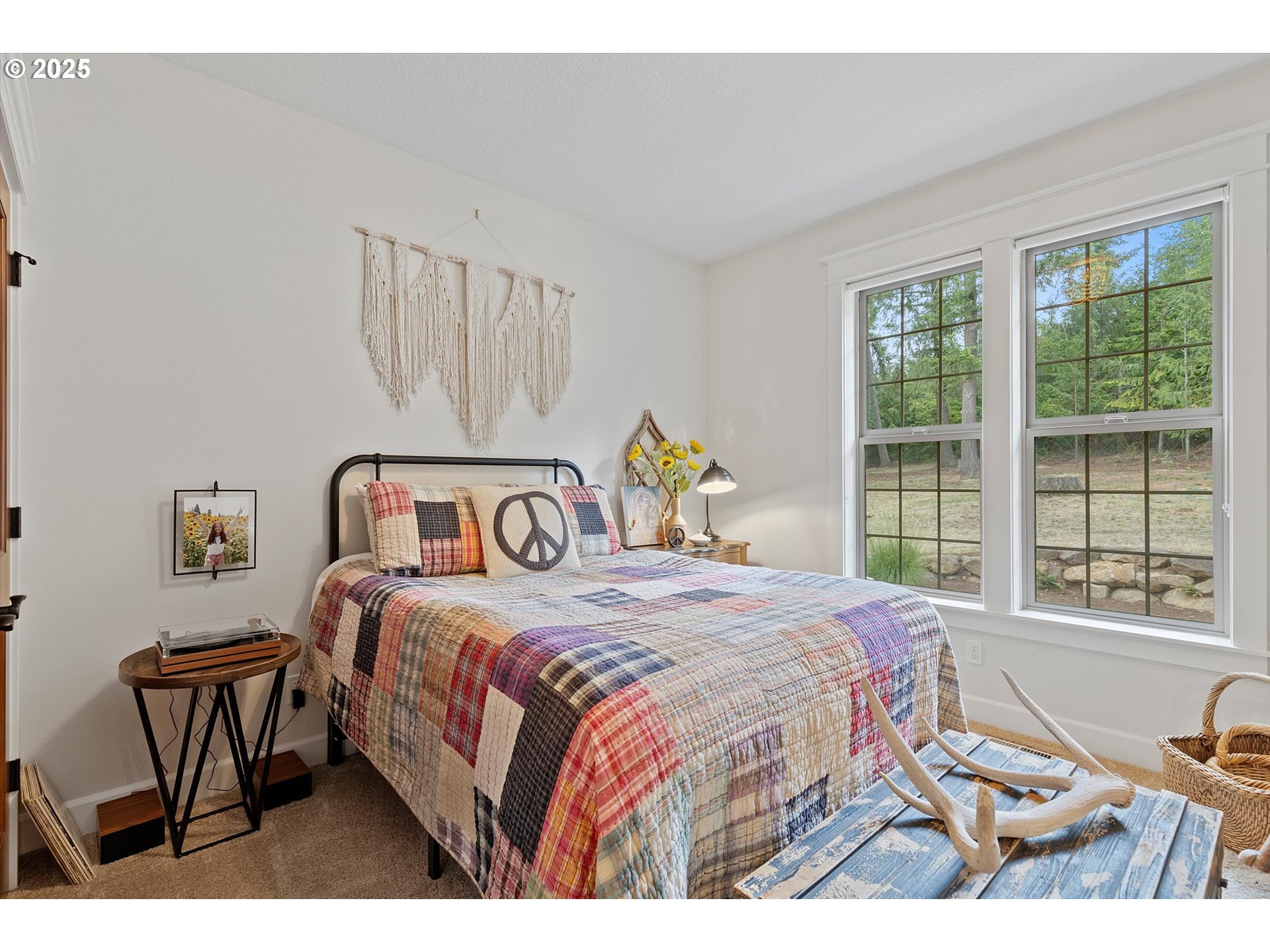 37212 South Sawtell Road Molalla, OR 97038 - Photo 17 of 46 a bedroom with a bed and a table