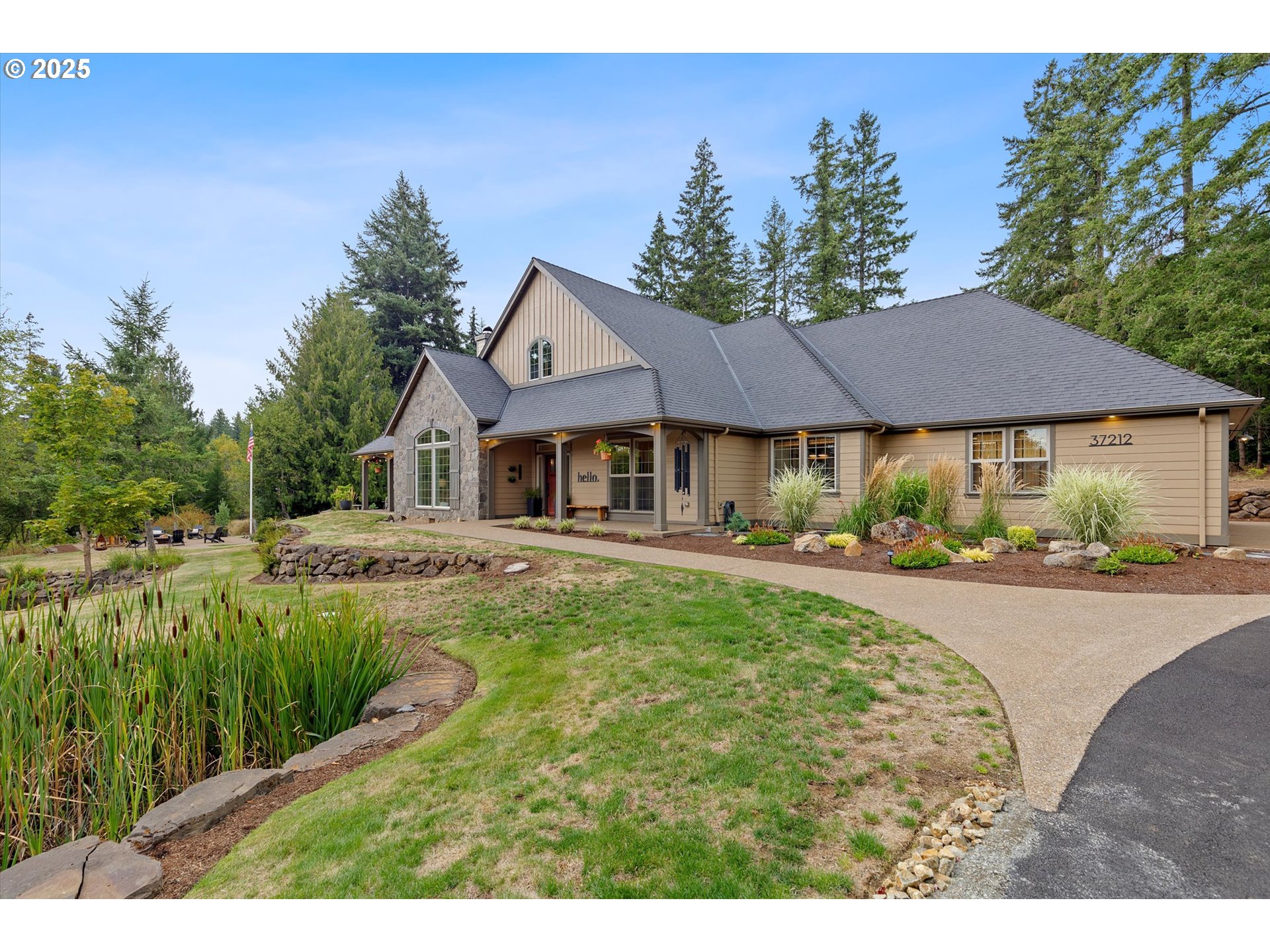 37212 South Sawtell Road Molalla, OR 97038 - Photo 2 of 46 a house with swimming pool in front of it
