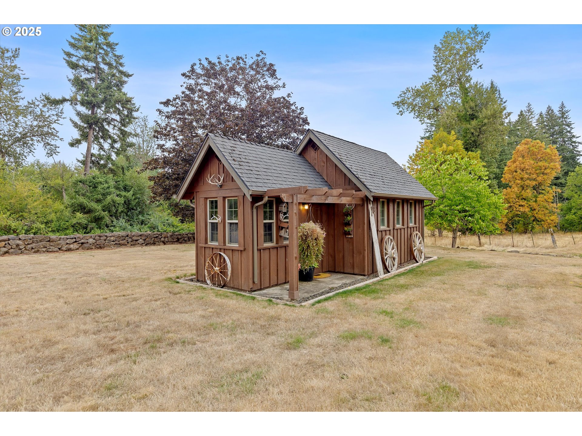 37212 South Sawtell Road Molalla, OR 97038 - Photo 22 of 46 a view of a house with a yard and large tree