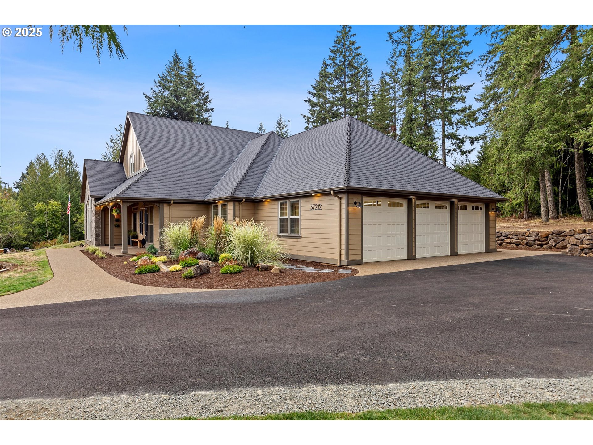 37212 South Sawtell Road Molalla, OR 97038 - Photo 30 of 46 a front view of a house with a garden and pathway
