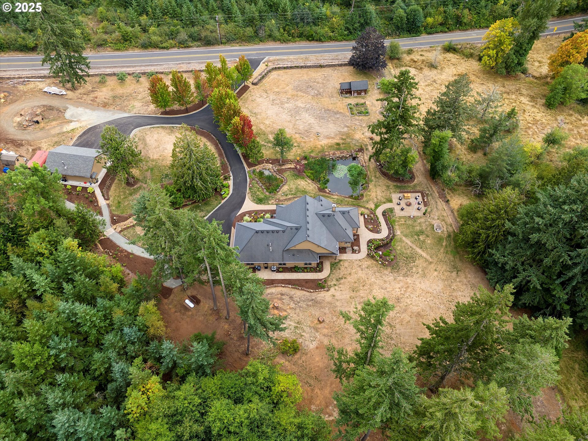 37212 South Sawtell Road Molalla, OR 97038 - Photo 33 of 46 an aerial view of swimming pool outdoor seating and yard