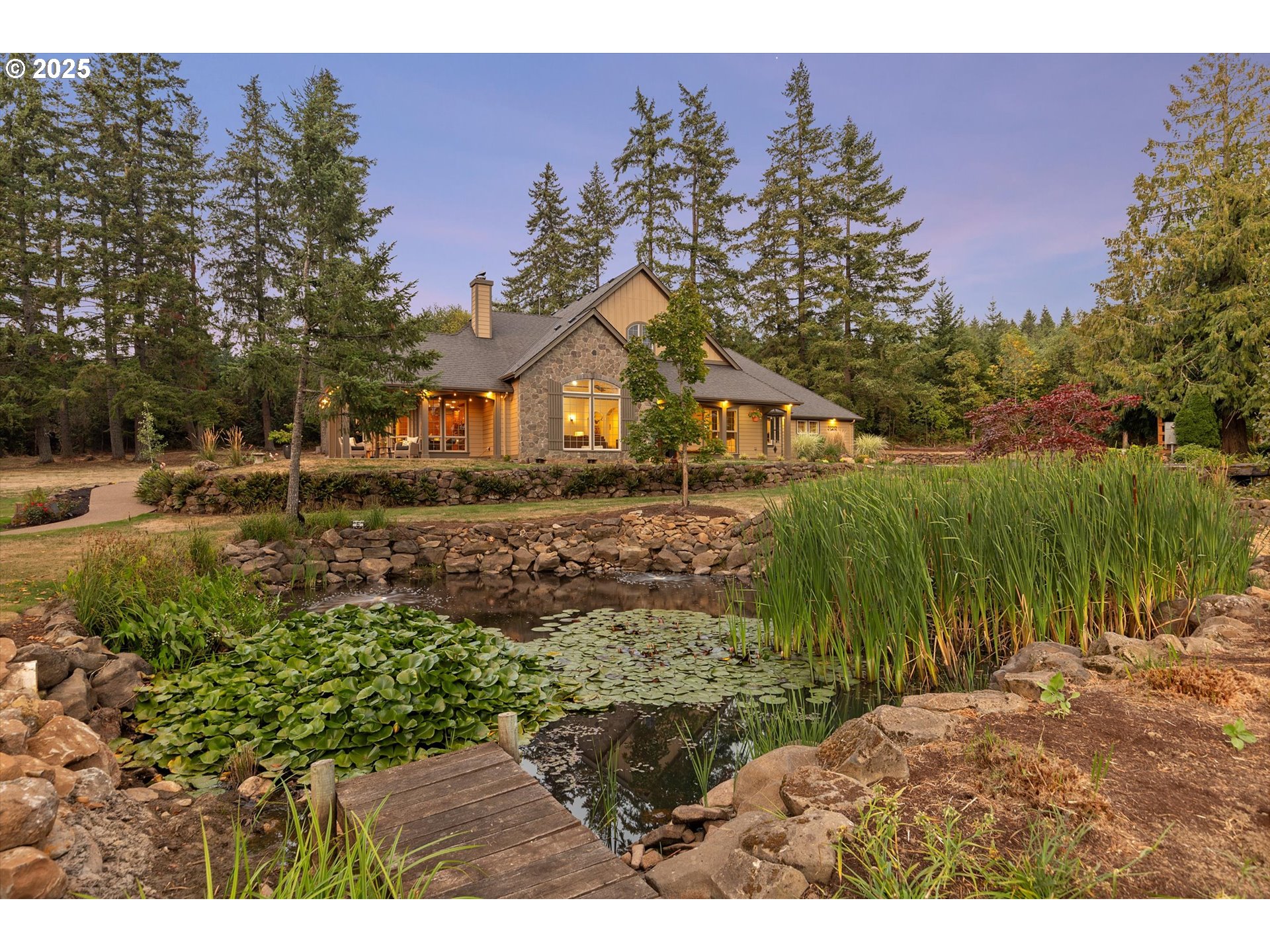 37212 South Sawtell Road Molalla, OR 97038 - Photo 42 of 46 a view of a large garden with plants and large trees