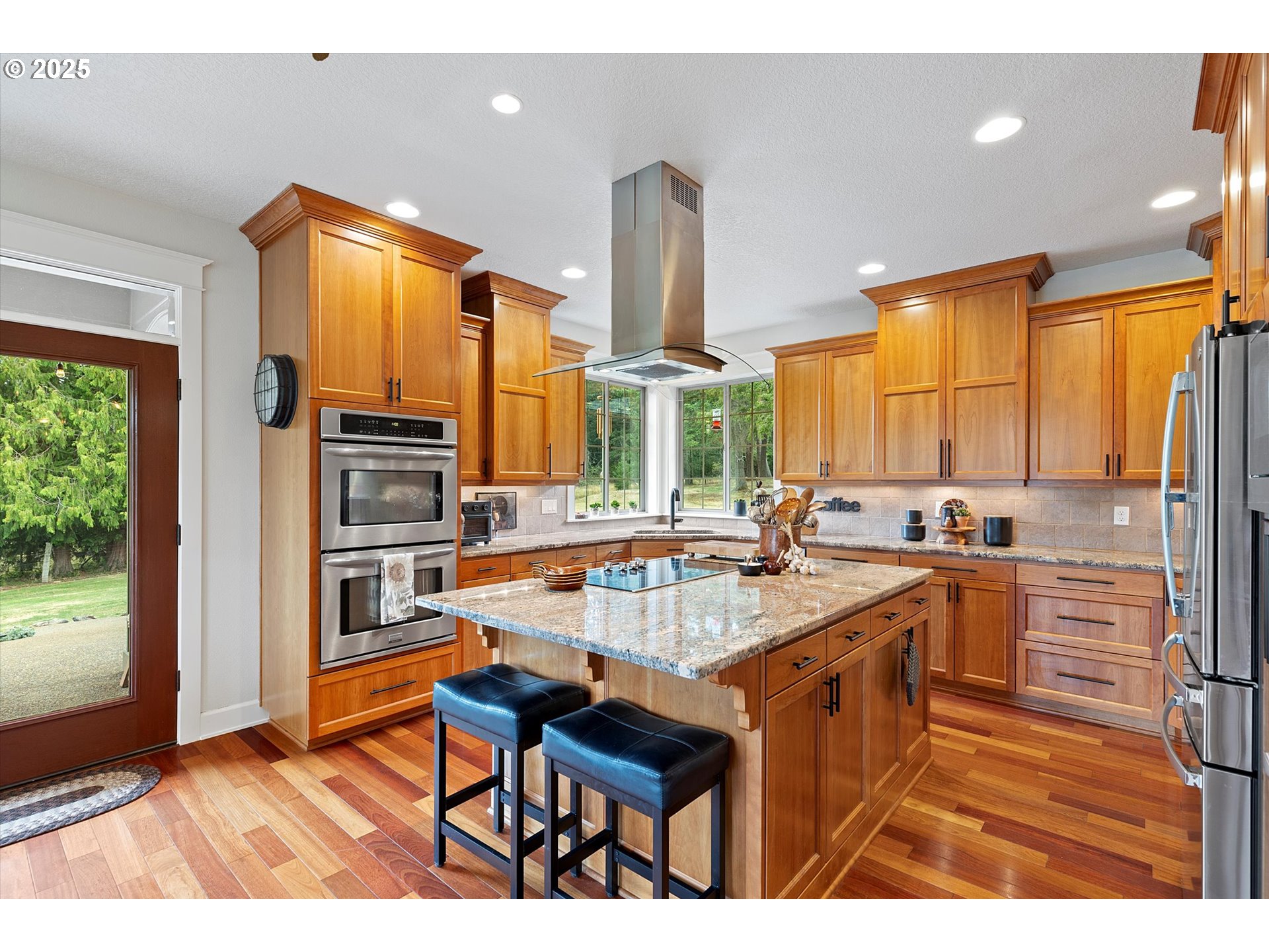 37212 South Sawtell Road Molalla, OR 97038 - Photo 8 of 46 a kitchen with stainless steel appliances a sink a counter top space a large window and wooden floor