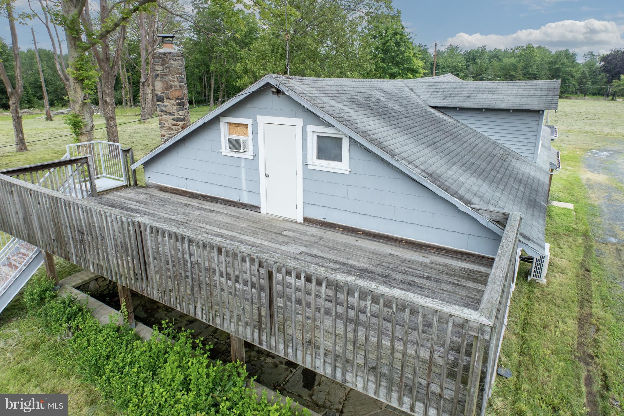 2488 Sanatoga Road Pottstown, PA 19464 - Photo 13 of 92 a view of a house with wooden deck