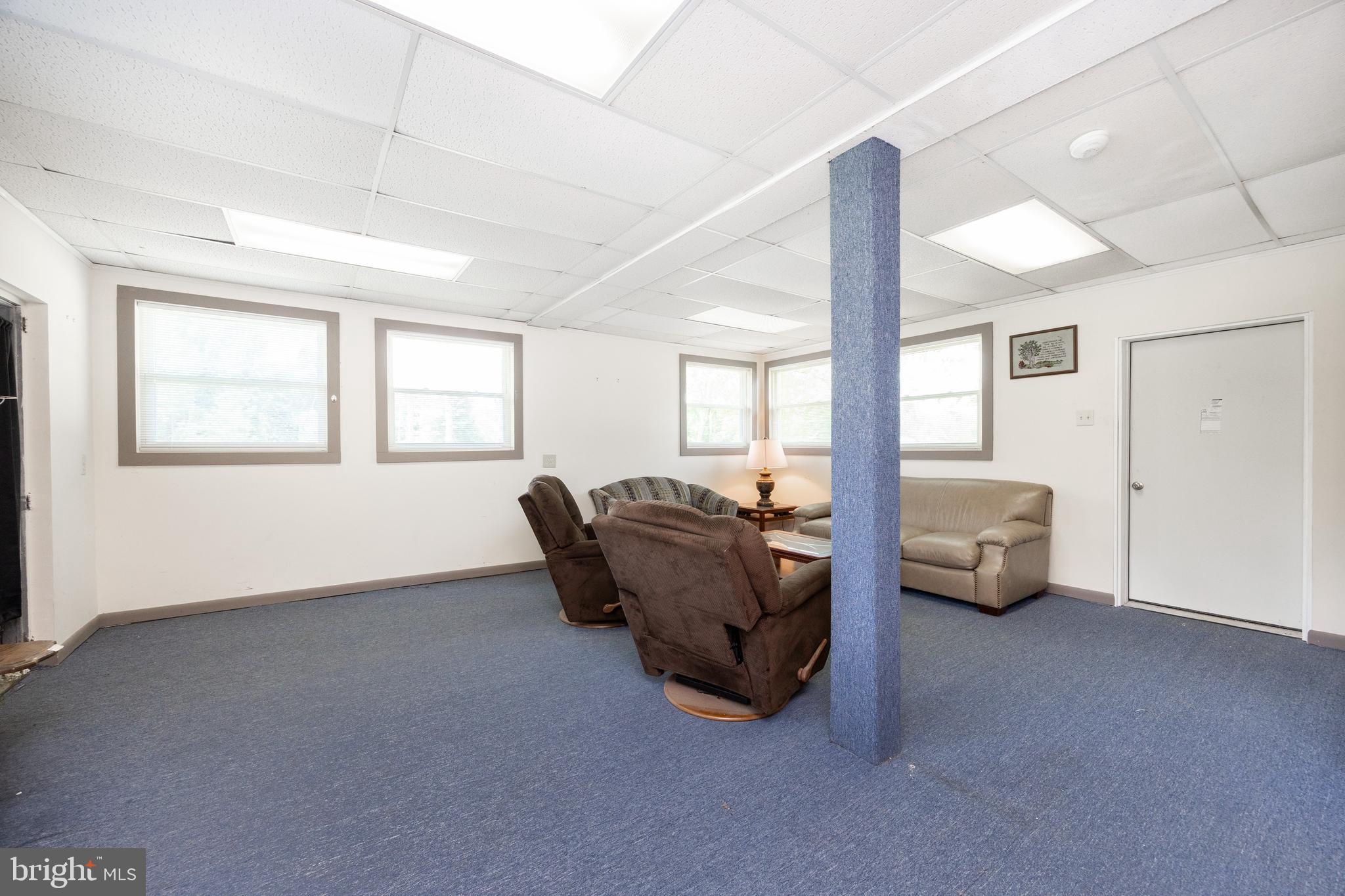 2488 Sanatoga Road Pottstown, PA 19464 - Photo 24 of 92 a living room with furniture and large windows