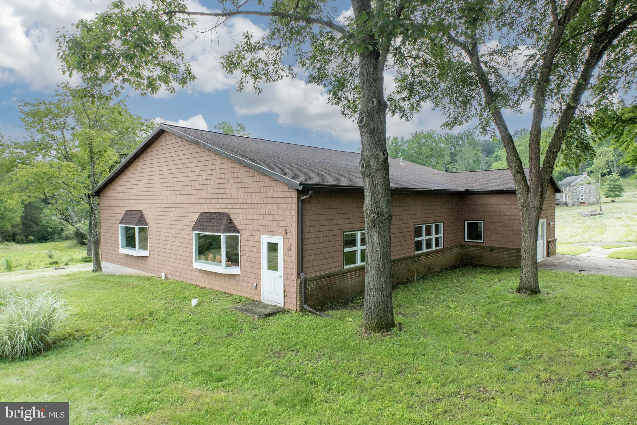 2488 Sanatoga Road Pottstown, PA 19464 - Photo 40 of 92 a view of a house with a backyard