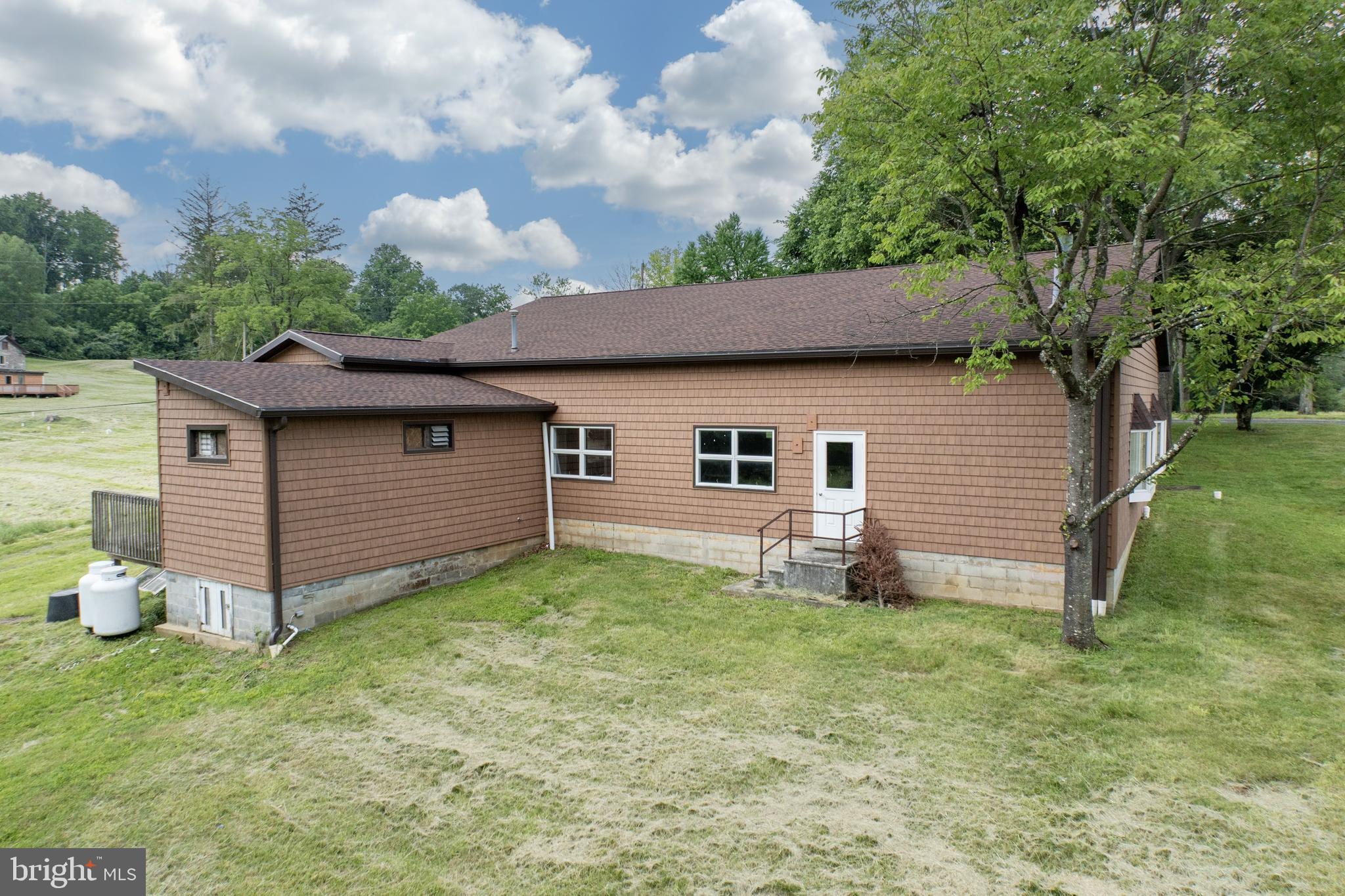 2488 Sanatoga Road Pottstown, PA 19464 - Photo 42 of 92 a front view of a house with garden