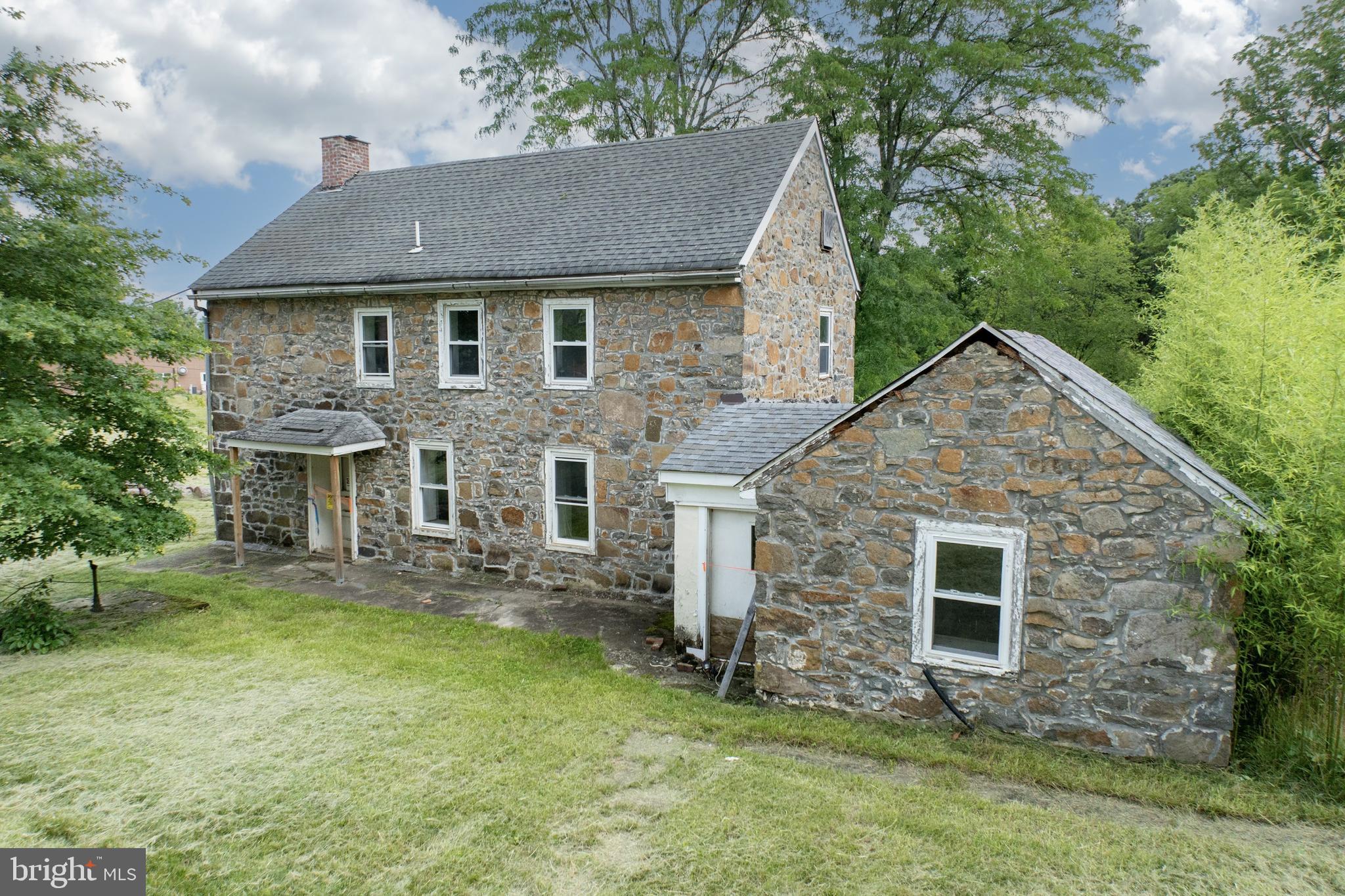 2488 Sanatoga Road Pottstown, PA 19464 - Photo 62 of 92 front view of a house with a yard