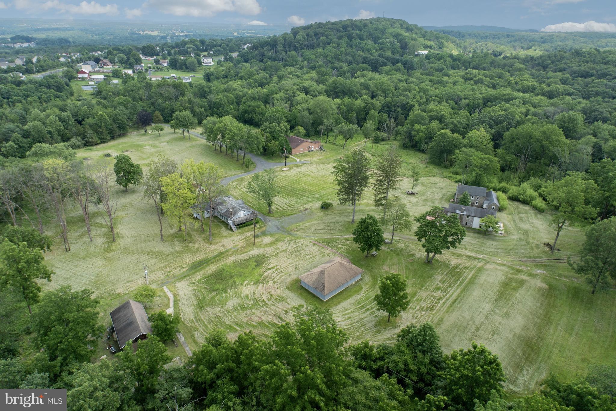 2488 Sanatoga Road Pottstown, PA 19464 - Photo 7 of 92 an aerial view of residential houses with outdoor space and trees