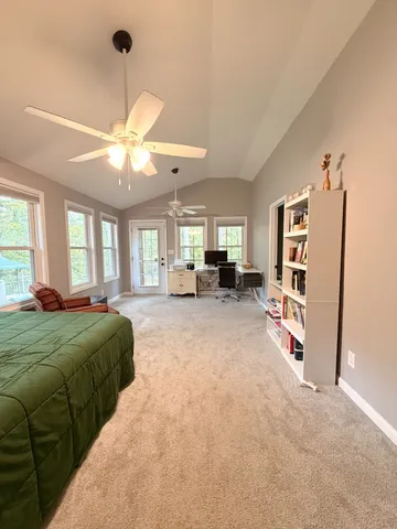 a living room with furniture dining table and a chandelier