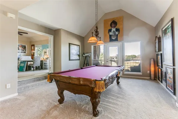 a living room with furniture gym equipment and a flat screen tv