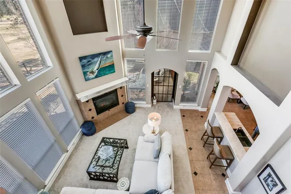 a living room with furniture and a dining table