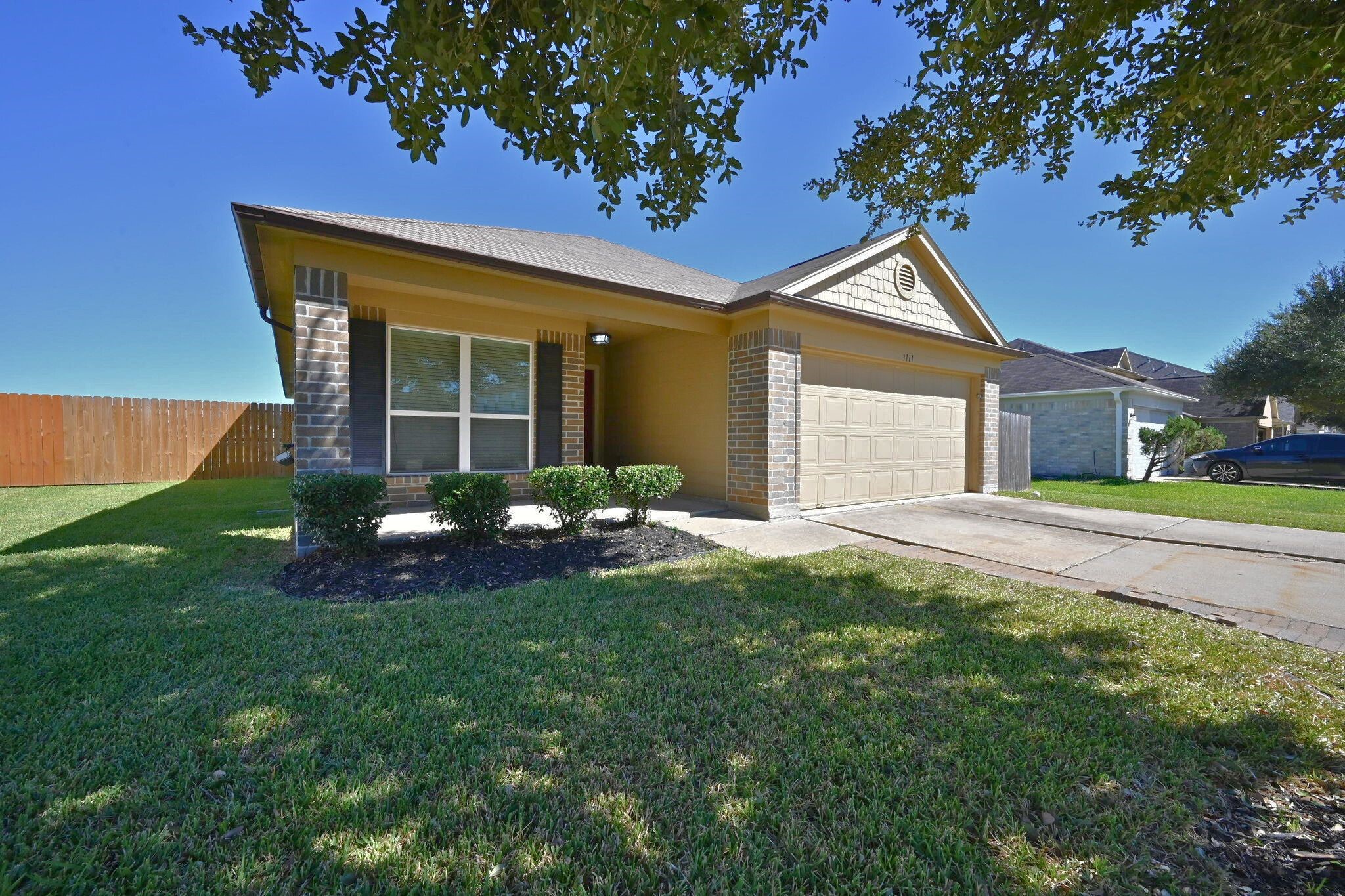 a front view of a house with a yard and porch