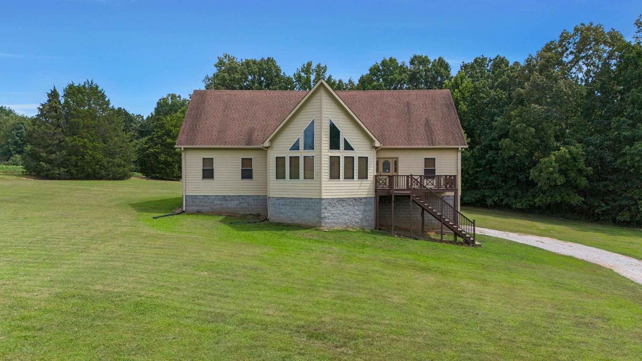 4664 New Cut Road Greenbrier, TN 37073 - Photo 17 of 87 a house that has a big yard with wooden fence