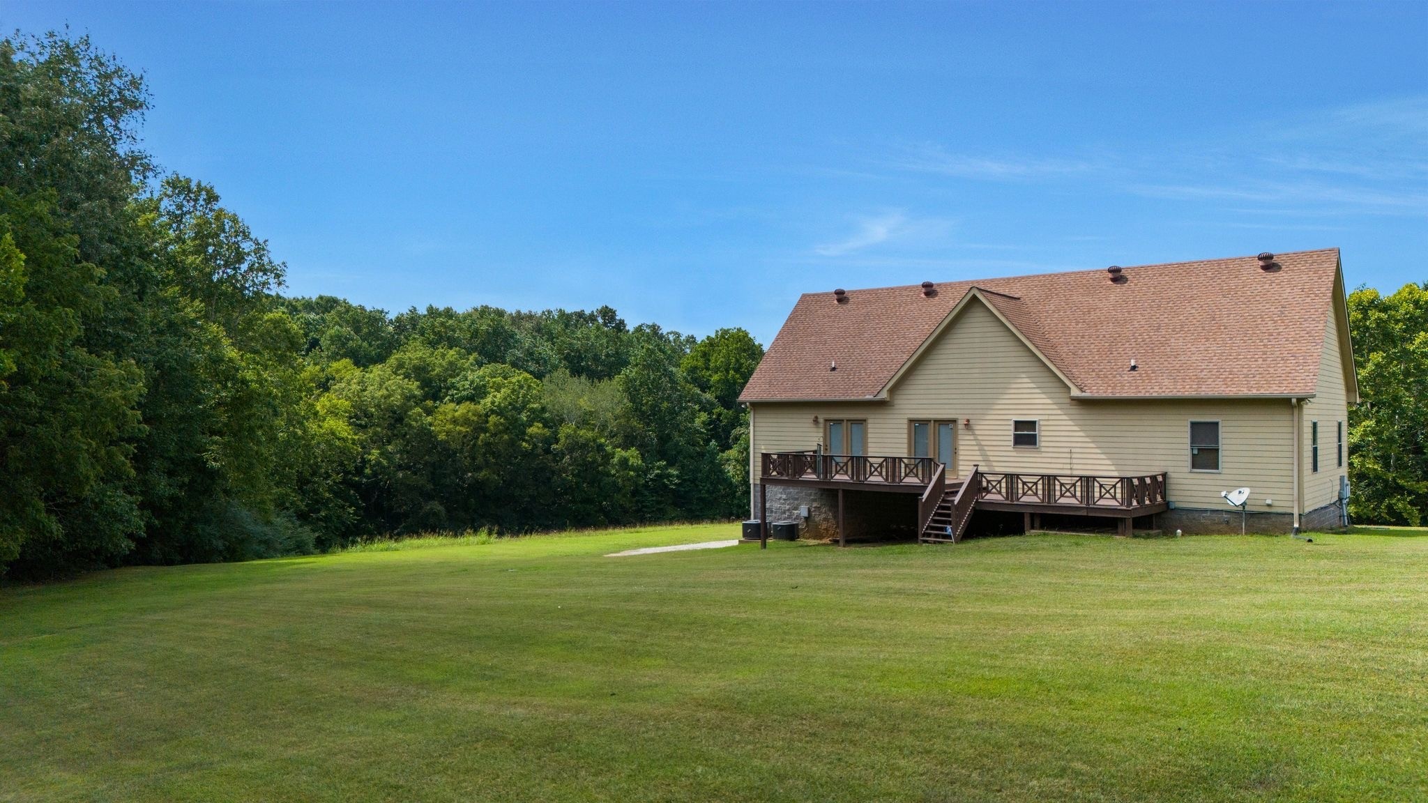 4664 New Cut Road Greenbrier, TN 37073 - Photo 24 of 87 a view of a house with a big yard and large trees