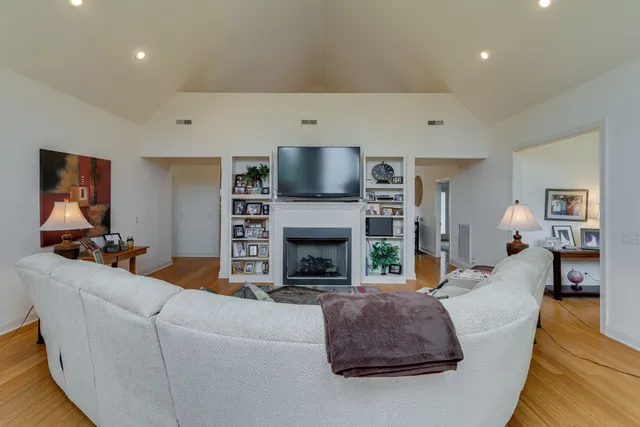 a big yard with lots of green space and mountain view in back