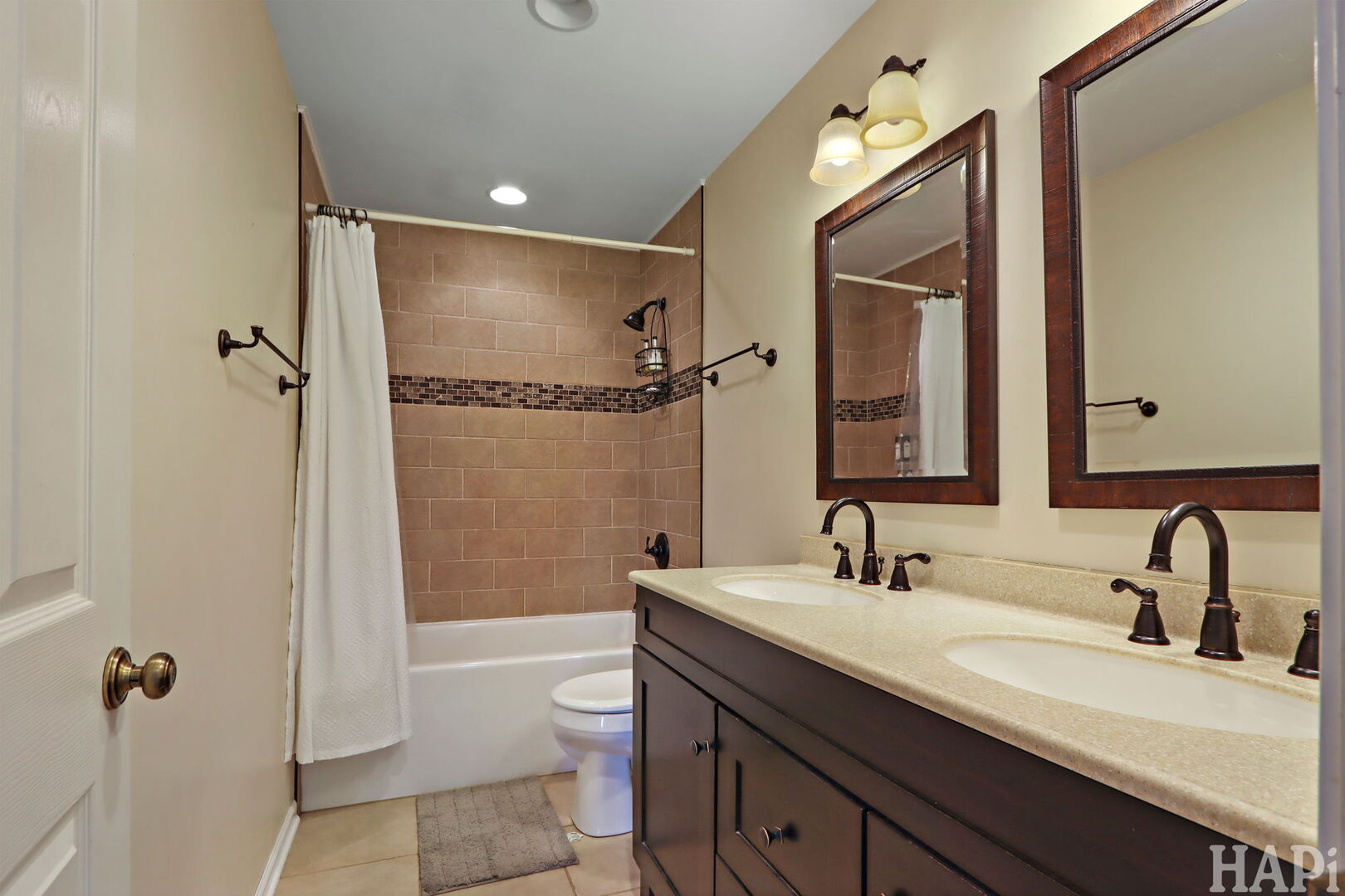 2817 Weld Road Elgin, IL 60124 - Photo 17 of 35 a bathroom with a double vanity sink toilet mirror and shower
