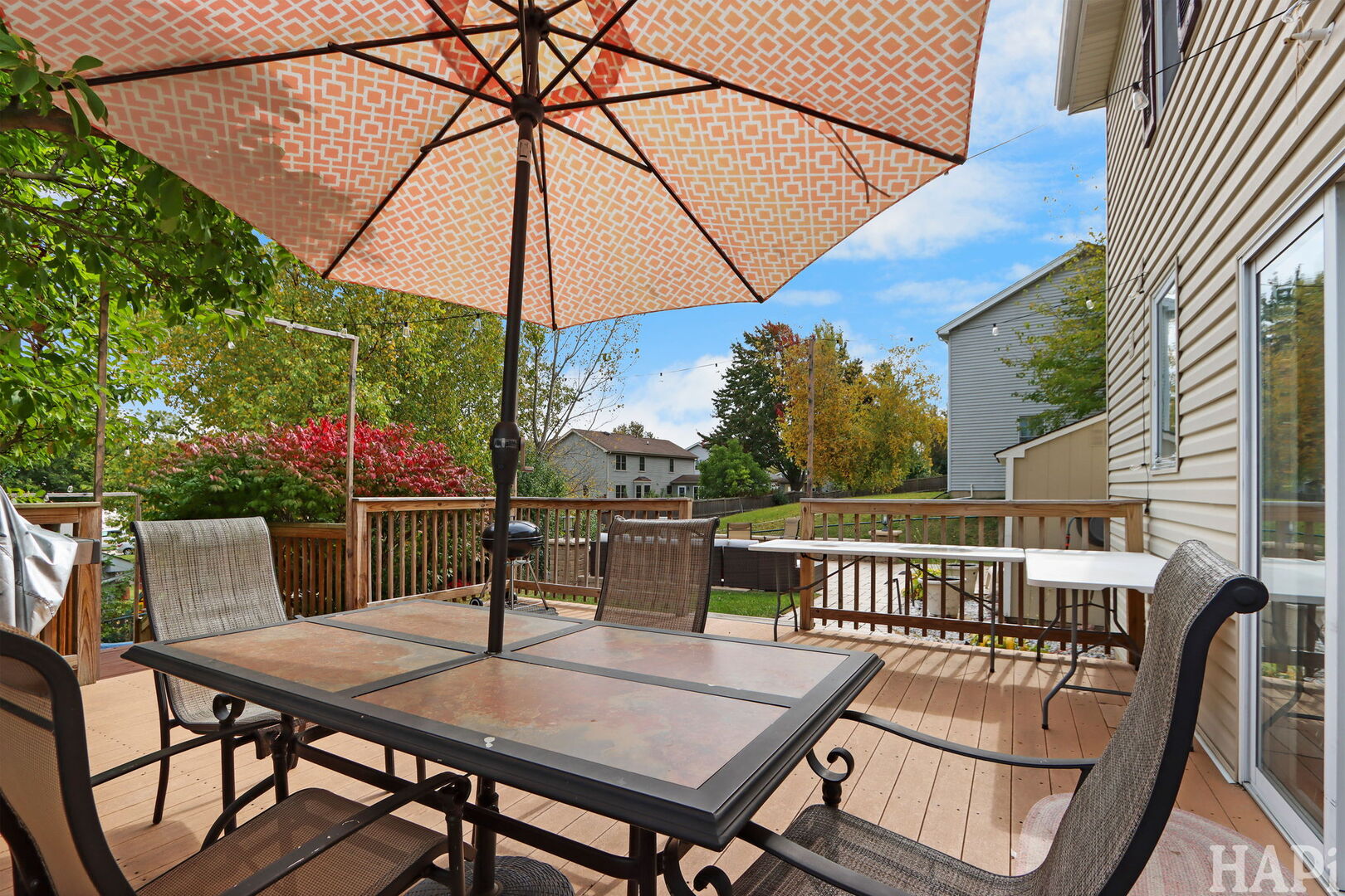 2817 Weld Road Elgin, IL 60124 - Photo 25 of 35 a roof deck with a table and chairs under an umbrella