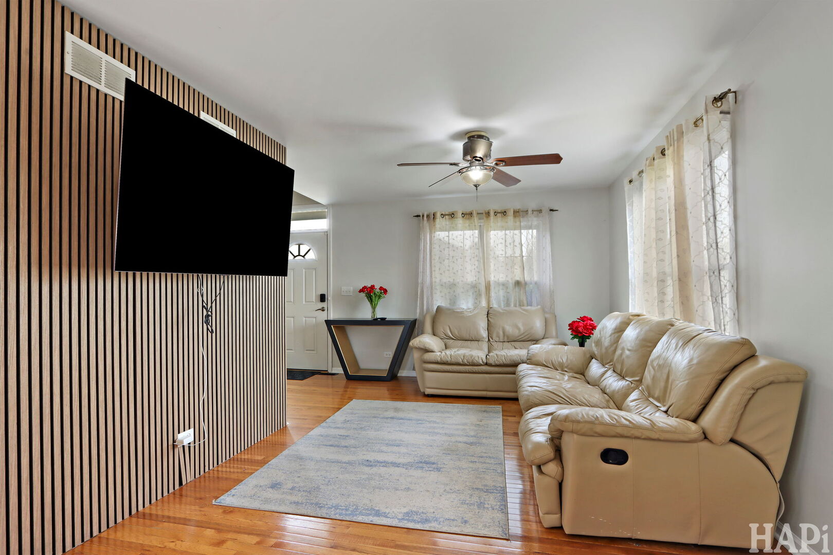 2817 Weld Road Elgin, IL 60124 - Photo 5 of 35 a living room with furniture and a flat screen tv