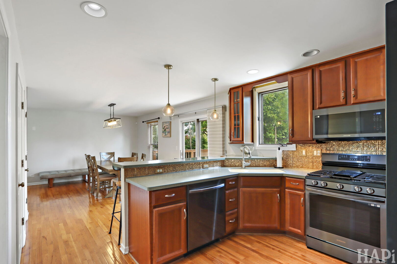 2817 Weld Road Elgin, IL 60124 - Photo 10 of 35 a kitchen with stainless steel appliances granite countertop a sink stove and cabinets