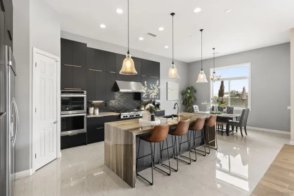 a large kitchen with a table and chairs