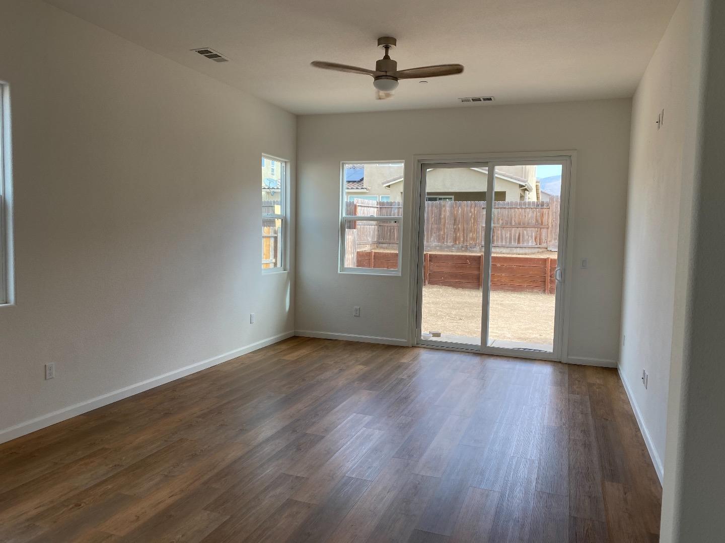 1233 La Colina Street Soledad, CA 93960 - Photo 5 of 10 a view of empty room with wooden floor and fan