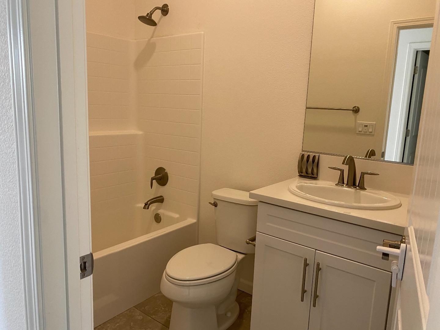 1233 La Colina Street Soledad, CA 93960 - Photo 6 of 10 a bathroom with a sink a toilet and shower