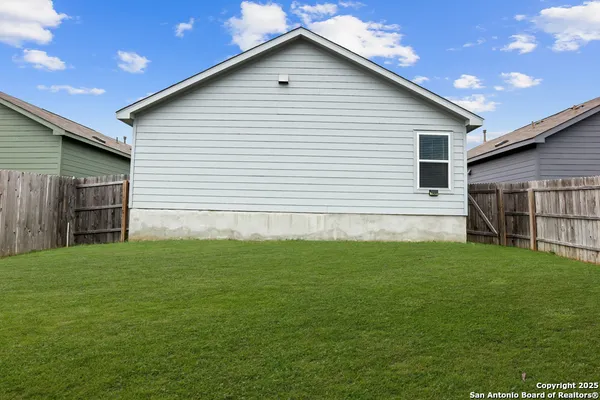 a view of swimming pool with outdoor seating and a lake view
